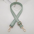 Detail of adjustable green nylon strap with white arrow pattern and gold metal hooks - Matcha Green