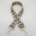 Close-up of vintage jacquard strap with gold hardware and European floral pattern - Beige Yellow Black