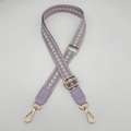Detail view of light purple woven shoulder strap with gold metal hardware and texture - Light Purple
