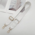 Close-up of adjustable white PU leather bag strap with gold metal buckle and lobster clasp - White