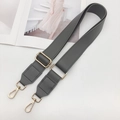 Detail of adjustable dark grey PU leather handbag strap with polished gold metal hardware - Gold Hardware / Dark Gray