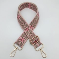 Dettaglio del ricamo etnico rosa e marrone su tracolla larga regolabile per borse - Rosa Fucsia Con Base Beige