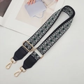 Detail view of adjustable geometric diamond pattern bag strap with gold metal hardware - Gold Hook / Black/Green with Black Leather