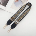 Detail of adjustable ethnic embroidery guitar strap with gold metal hooks and leather ends - Gold Hook / Black/White/Brown with Black Leather
