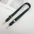 Detail of adjustable dark green PU leather shoulder strap with gold metal swivel hooks - Green