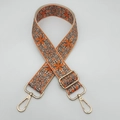 Detail of embroidered ethnic style bag strap with orange pattern and gold metal hooks - Gold Hook / Beige/Orange