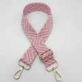 Detail of adjustable wide woven shoulder strap with pink geometric jacquard and gold metal hooks - Light Pink Apricot / Gold