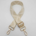 Detail of adjustable beige chevron woven shoulder strap with gold metal lobster clasps - Beige / Gold
