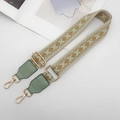 Close-up of woven jacquard purse strap with green geometric pattern and gold hardware - Beige/Green/Brown with Matcha Green Leather