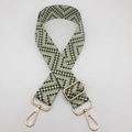 Close-up of geometric woven strap with gold metal buckle and lobster clasps - Army Green / Gold