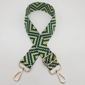 Detail of green and yellow geometric woven bag strap with golden metal swivel hooks - Green / Gold