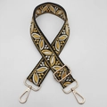 Detail of adjustable woven guitar strap with leaf pattern and gold metal lobster clasps - Yellow on Black
