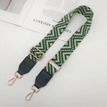 Detail of wide ethnic style bag strap with green geometric pattern and golden metal hook - Gold Hook / Green + Green Leather