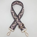 Detailed view of adjustable guitar-style pink floral woven strap with gold metal buckles - Black Base Light Pink