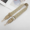 Detail of adjustable geometric jacquard strap with gold metal hooks and leather ends - Khaki Edge Green with Apricot Leather