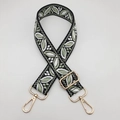Detail showing wide adjustable guitar style shoulder strap with green leaf jacquard pattern - Black Base Matcha Green