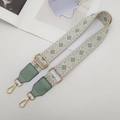 Detail of adjustable geometric ethnic strap with golden metal clasps and green leather trim - White/Matcha Green with Matcha Green Leather