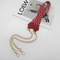 Detail of red and white woven bag strap with golden metal chain and lobster clasps - Red With Wine Red Leather