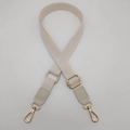 Detail of adjustable off-white woven shoulder strap with gold-tone metal buckles - Off White