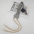 Detail of grey geometric woven shoulder strap with gold chains and lobster clasps - Light Gray With Gray Leather