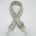 Adjustable jacquard woven bag strap with green leaf patterns and gold metal hooks - Beige Base Matcha Green
