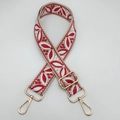 Detail of red and white floral embroidered guitar style strap with gold metal lobster clasps - Beige Red