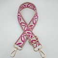 Detail of adjustable wide woven bag strap with pink floral embroidery and gold metal hooks - Beige Rose Red
