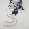 Detail of the woven geometric pattern shoulder strap with golden metal chains and lobster clasp - Deep Blue With Blue Leather