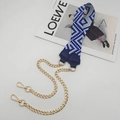 Detail of blue and white woven strap with golden metal chain and leather reinforcement - Royal Blue With Blue Leather