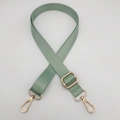 Detail of adjustable light green nylon shoulder strap with polished gold-tone metal hooks - Gold Hook / Matcha Green