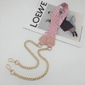 Detail of pink and white geometric webbing strap combined with a chunky gold chain - Sakura Pink With Pink Leather