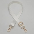 Close-up of cream adjustable woven bag strap with polished gold swivel metal hooks - Gold Hook / White