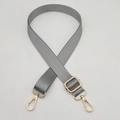 Detail of adjustable gray nylon bag strap with gold metal lobster swivel clasps - Gold Hook / Light Gray