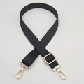 Macro detail of black nylon replacement strap with golden metal swivel lobster clasps - Gold Hook / Black