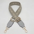 Close-up of adjustable woven shoulder strap with geometric patterns and leather details - Type 2 Gray With Gray Leather