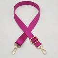 Close-up of adjustable magenta nylon bag strap with polished light gold metal buckles - Silver Hook / Rose Red