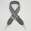 Close-up of geometric pattern crossbody bag strap with golden lobster clasps - Dark Gray + Dark Gray Leather