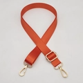 Detail of adjustable orange woven bag strap with golden lobster clasps and metal hardware - Silver Hook / Orange