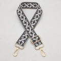 Close-up of bohemian navy and cream jacquard bag strap with gold metal swiveling clasps - Beige Dark Blue