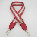 Close-up of adjustable red strap with gold metallic stripes and leather accents - Gold Hook / Red Gold Thread + Red Leather