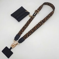 Detailed view of leopard print crossbody phone strap with matching leather coin purse - Light Brown Black Leather