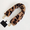 Detail of leopard print faux fur phone lanyard strap with gold clasps and black patch - Brown Leopard Print
