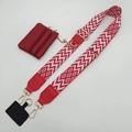 Detail view of red geometric woven strap with mini zipper pouch and gold metal hardware - Red