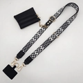 Adjustable crossbody phone strap with black-white woven pattern and gold metal hardware - Black and White