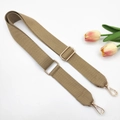 Close-up of khaki 3.8cm canvas bag strap with golden metal swivel hooks and buckle - Khaki