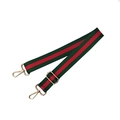 Macro detail of adjustable nylon bag strap with green and red stripes and gold hardware - Green Red Green