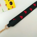 Fashionable black woven shoulder strap with red heart embroidery and gold chain details - Heart