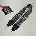 Macro shot of colorful woven guitar-style bag strap with gold metal buckle and leather ends - Width: 5.2 / Contrast Rhombus (#05)