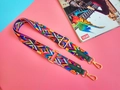 Detail of colorful geometric woven strap with gold metal buckles and leather finish - Green (Dark Green Edging)