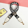 Detail of adjustable black and white woven canvas strap with gold metal hooks and white faux leather - White